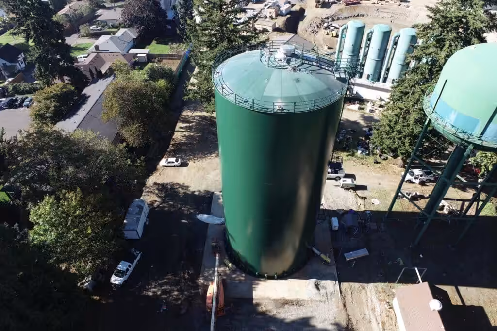 Large green water storage tank
