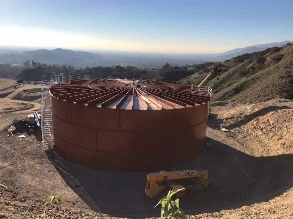 Large circular tank on hillside