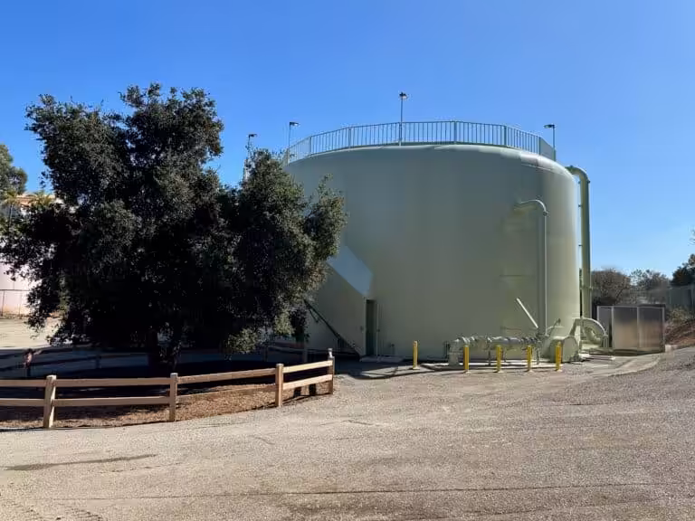 Large cylindrical storage tank outdoors